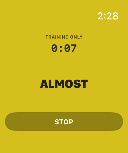 Apple Watch showing ALMOST on an amber screen